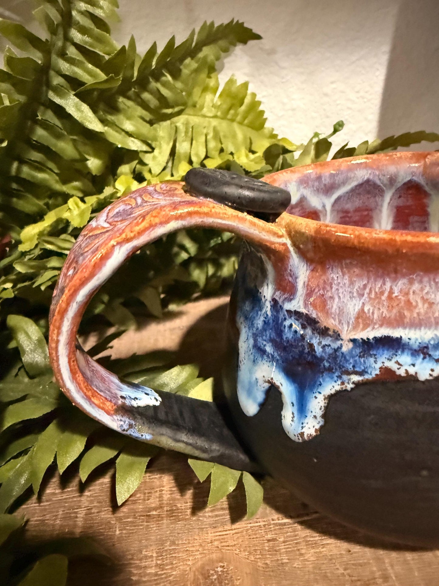 Black and purples stoneware mug .