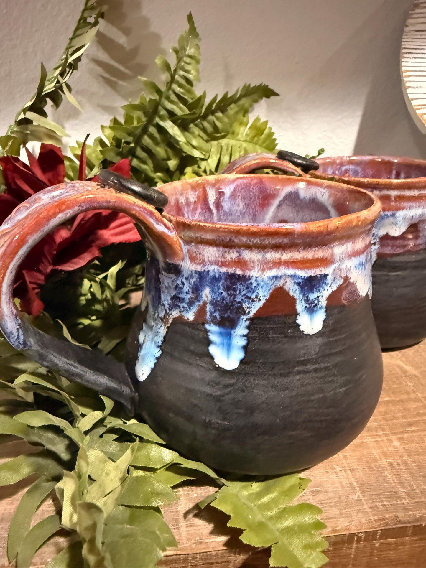 Black and purples stoneware mug .