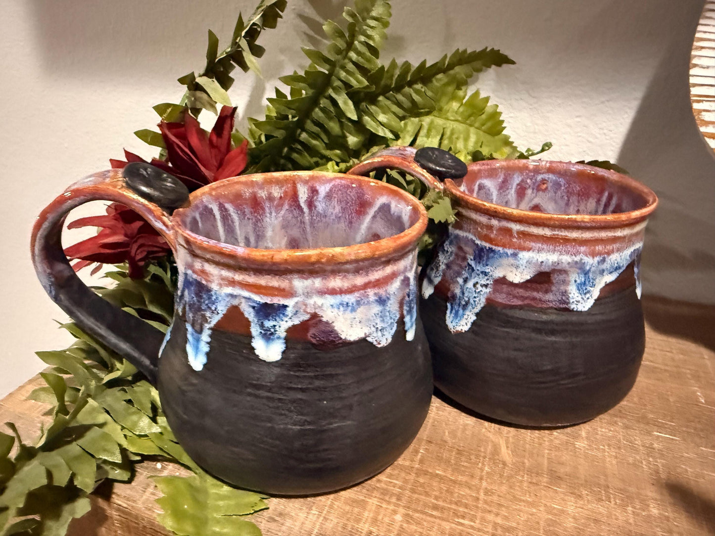 Black and purples stoneware mug .