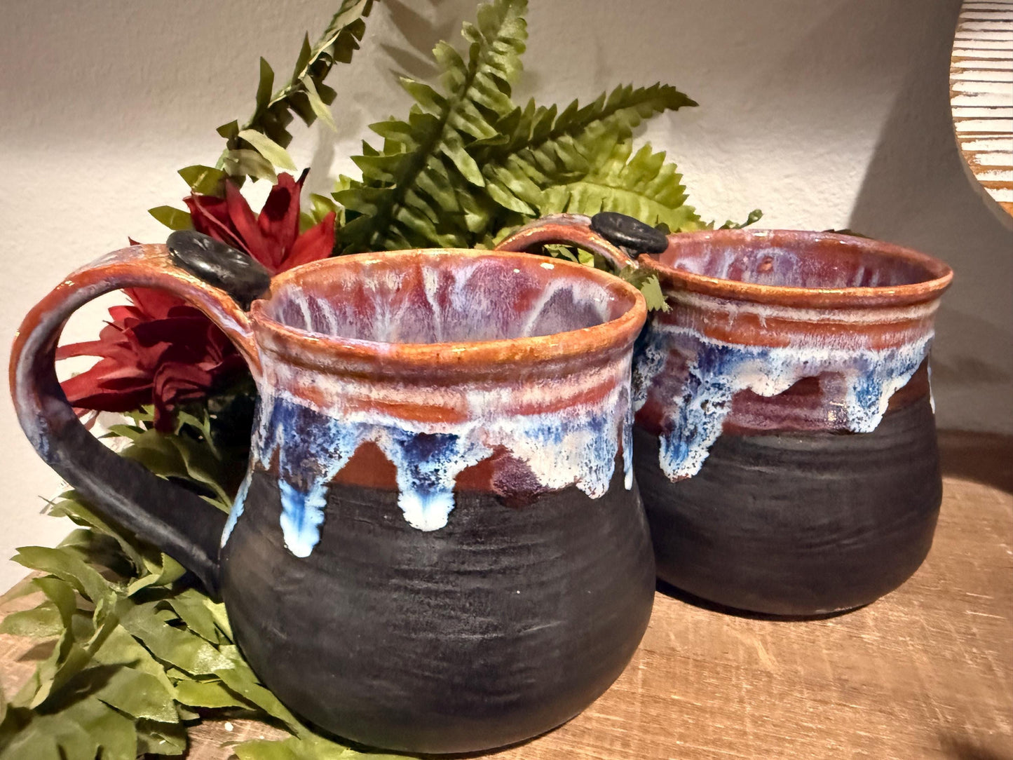Black and purples stoneware mug .